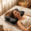 Woman resting on the Yuki cooling cervical pillow in a warm bedroom