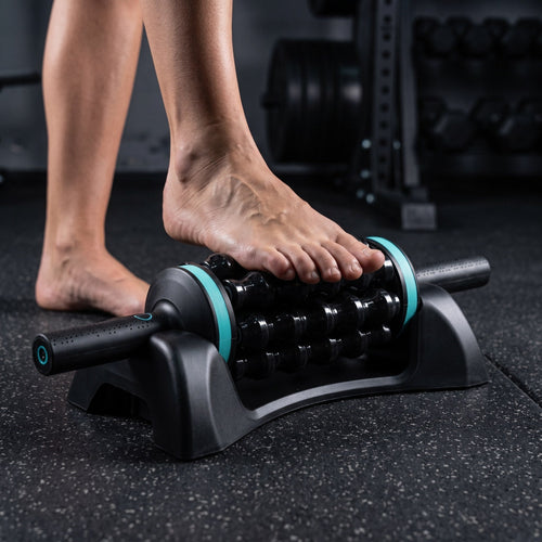 Bare foot pressing down on the Solvrly Terra roller bars